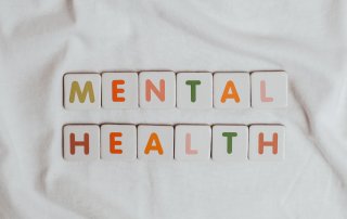 An individual reaching out for support, symbolizing the acceptance of seeking mental health assistance.