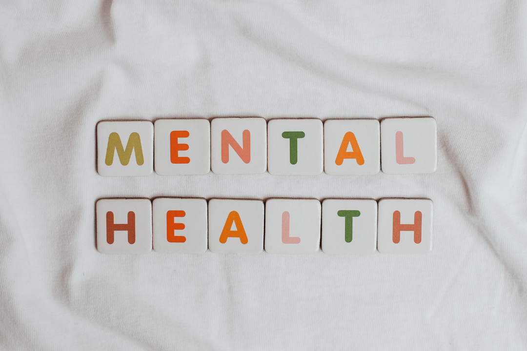 An individual reaching out for support, symbolizing the acceptance of seeking mental health assistance.