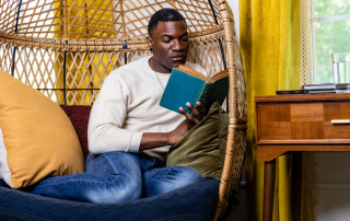 An individual engaging in a relaxing activity, symbolizing the practice of nurturing self-care.
