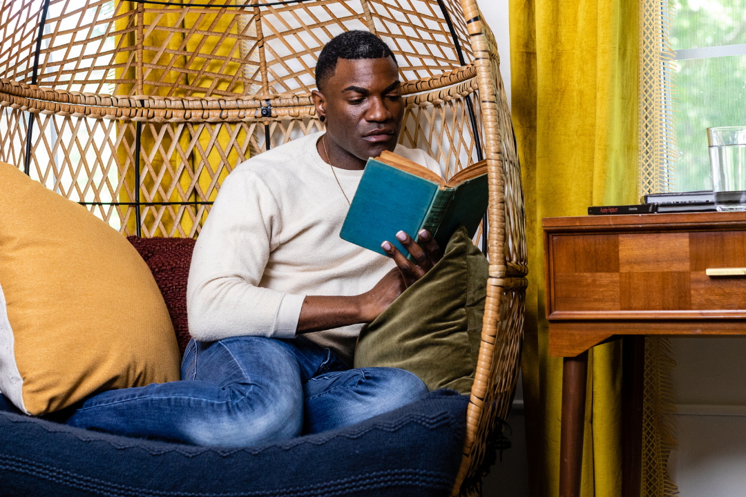 An individual engaging in a relaxing activity, symbolizing the practice of nurturing self-care.