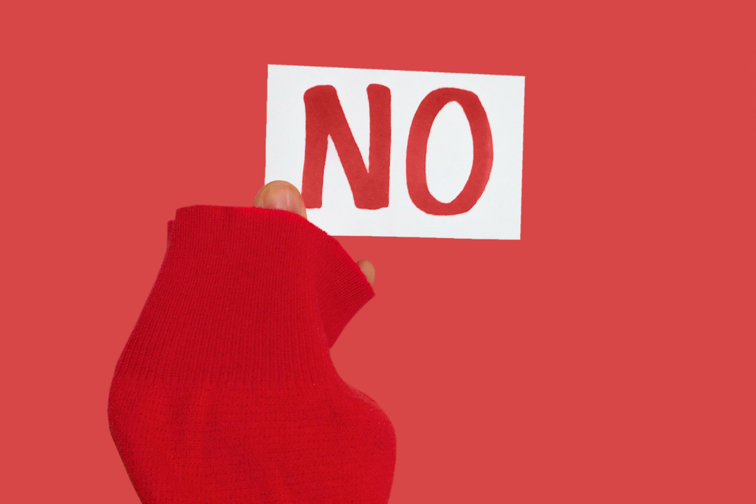 An individual confidently saying 'no,' symbolizing the empowerment that comes with setting personal boundaries.