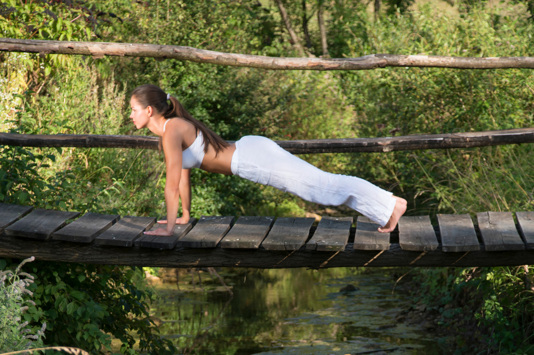 An individual enjoying a serene natural setting, symbolizing the restorative power of nature on mental well-being.