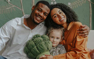 A family engaging in a heartfelt conversation, symbolizing the importance of early adoption disclosure in nurturing identity and trust.