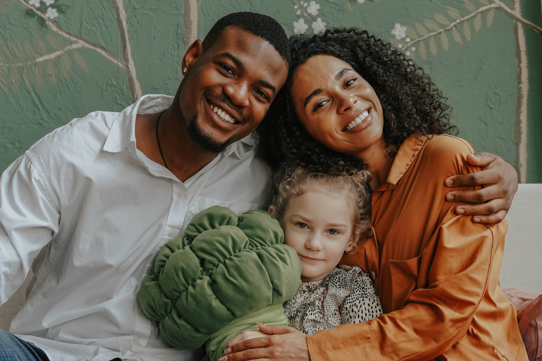 A family engaging in a heartfelt conversation, symbolizing the importance of early adoption disclosure in nurturing identity and trust.