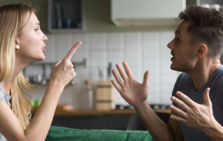 A couple engaging in open dialogue, symbolizing effective communication strategies in resolving conflicts.