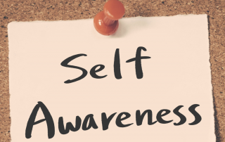A counsellor engaging in self-reflection, symbolizing the role of self-awareness in promoting personal growth.