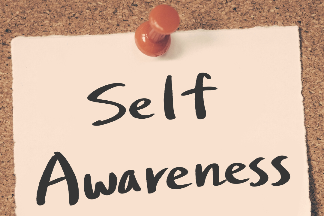 A counsellor engaging in self-reflection, symbolizing the role of self-awareness in promoting personal growth.