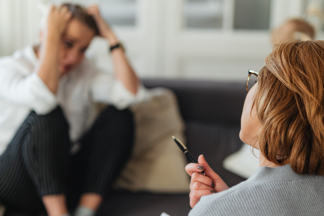 A therapist and client engaging in a session, symbolizing the exploration of transference and countertransference dynamics in therapy."