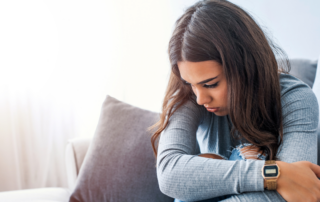 An individual offering support to a distressed family member, symbolizing the challenges of coping with a parent's mental illness