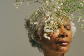 An individual practicing mindfulness meditation, symbolizing the journey towards present-moment awareness and mental well-being.