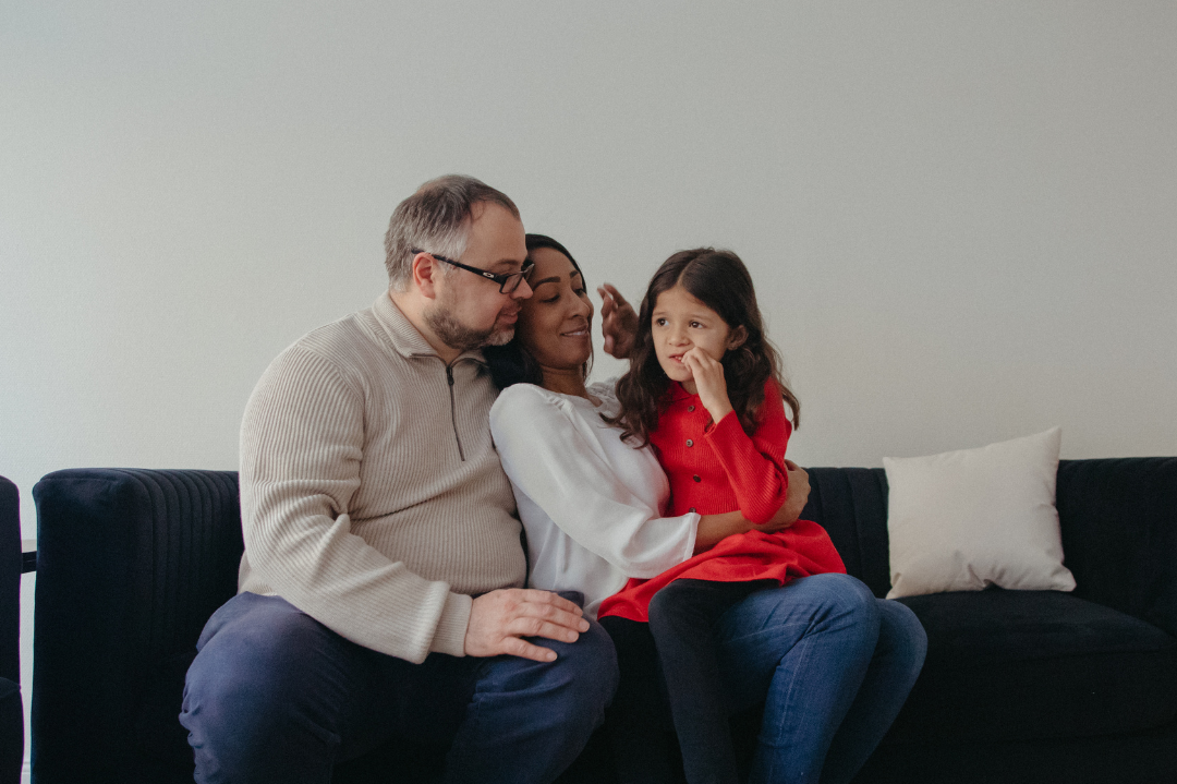 A supportive family embracing a neurodiverse member, symbolizing acceptance and empowerment in the journey of neurodiversity.