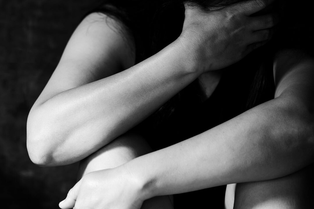 A person confidently setting personal boundaries, symbolizing empowerment and the journey to self-worth after experiencing domestic violence.