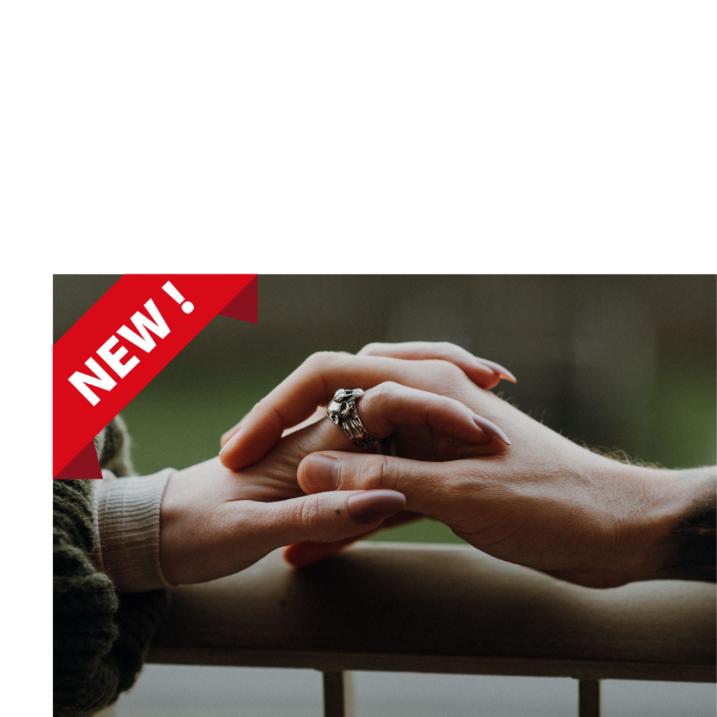 Close-up of a couple holding hands, symbolizing connection and emotional bonding in relationships.